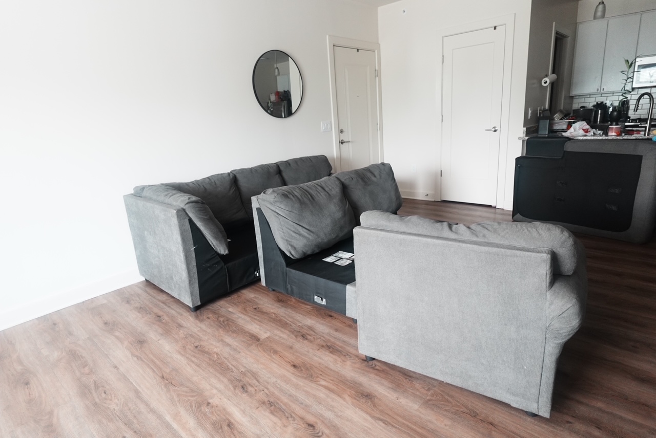 Living room sectional sofa removal — before