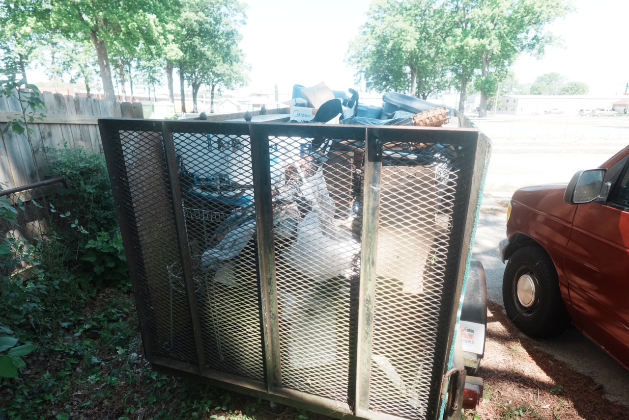 Trailer loaded with junk for disposal — after