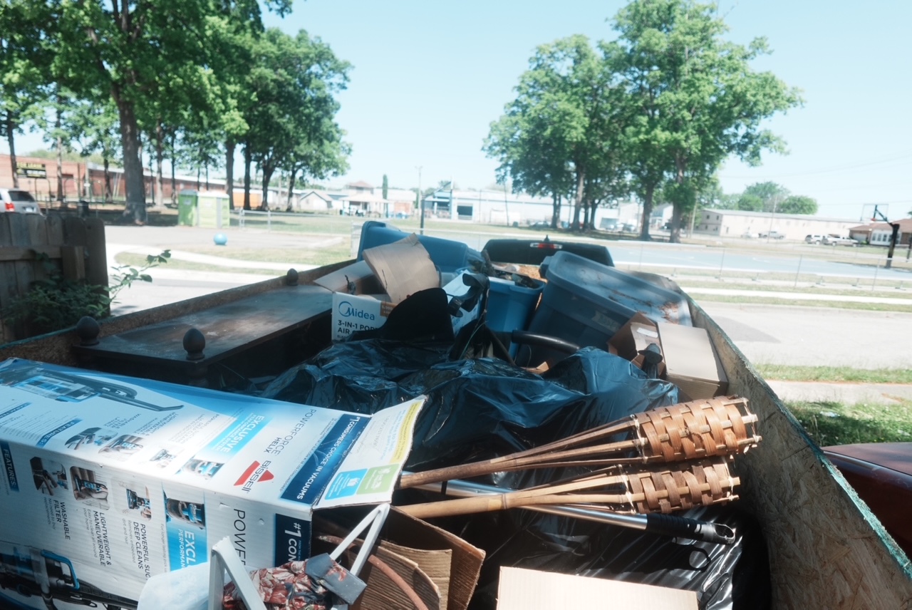 Trailer loaded with junk for disposal — before