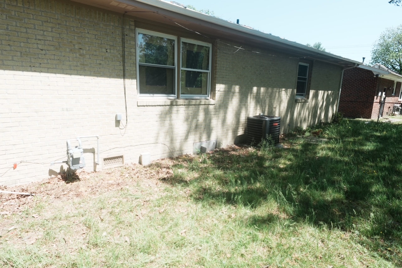 Side-yard junk pile cleanup — after